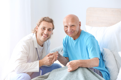 Caregiver and elderly smiling