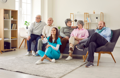 Caregiver helping the elderlies navigate the TV